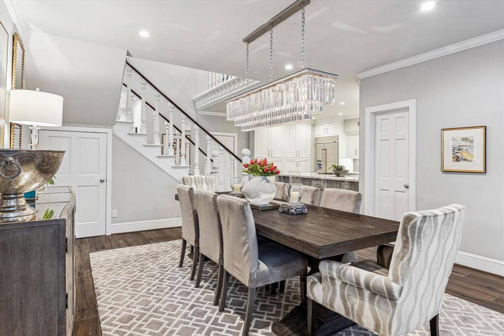 There is a storage area through the door underneath the stairs, and a convenient powder room is located across from the dining area.