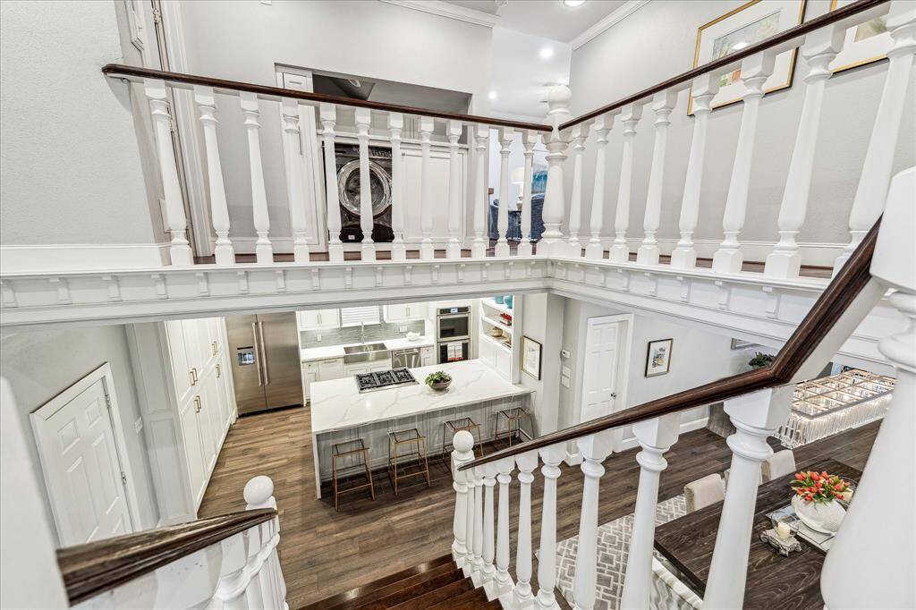 The second floor features two spacious bedrooms, a utility room, and a versatile game room.