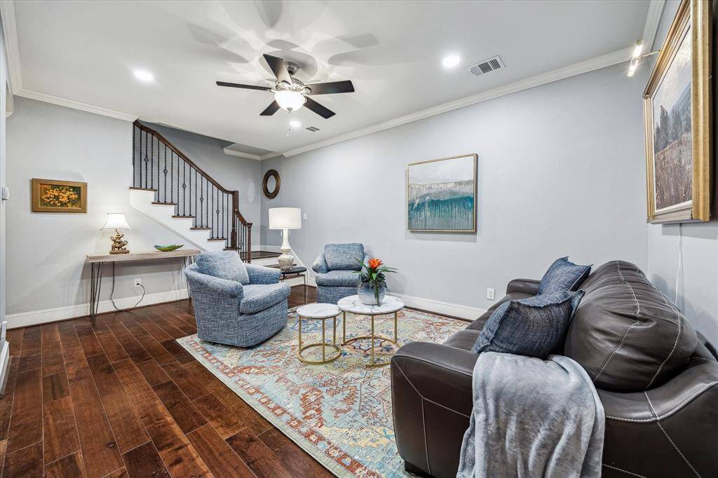 Situated between two bedrooms on the second level, the spacious game room offers a versatile space for entertainment or relaxation. Wood floors flows throughout the second level.