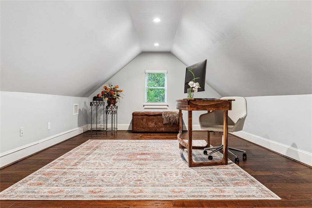 Up a few steps just off the game room, you'll find a spacious, versatile room that can serve as an office, bedroom, or flex space. This extra room offers endless possibilities, adding functional living space to suit your needs. This additional living space is not included in the square footage.