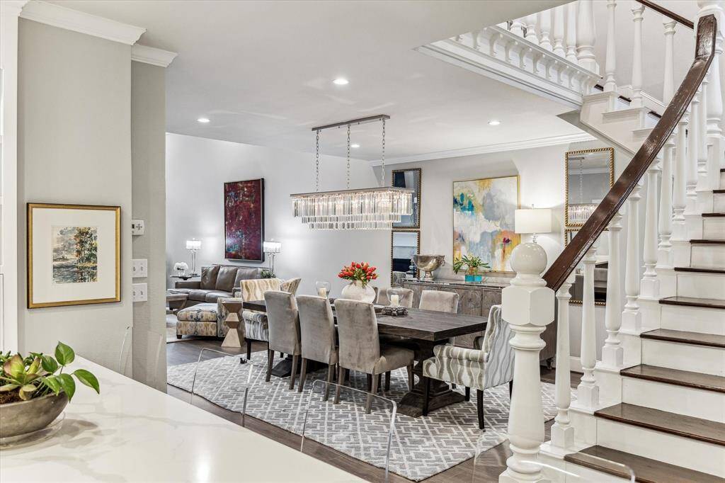 Beyond the entry, the home opens up to a spacious and inviting kitchen that seamlessly flows into the living and dining areas. The open-concept design on the first level creates a perfect space for both relaxed living and entertaining.