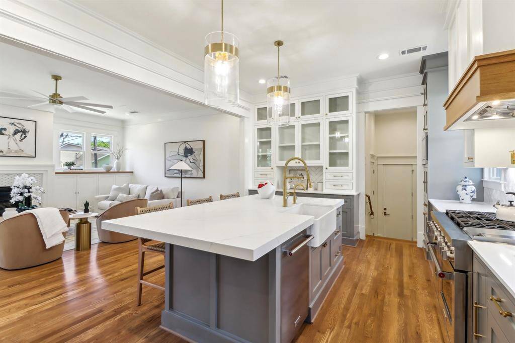 Stepping further into the kitchen, you will notice the island is built with extra seating on the side - nice for informal meals where people can face each other and talk! Straight ahead is the mud room, which leads to the garage.