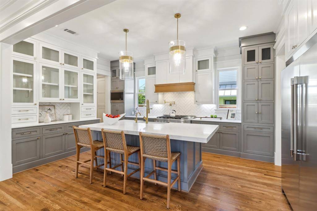 The buffet on the left is a throwback to the built-in buffets in many of the grand historical homes, and provides a useful space to showcase your favorite dishware. There are a ton of drwers in the kitchen and also amply closed cabinetry for the less-tidy homeowner (not you).