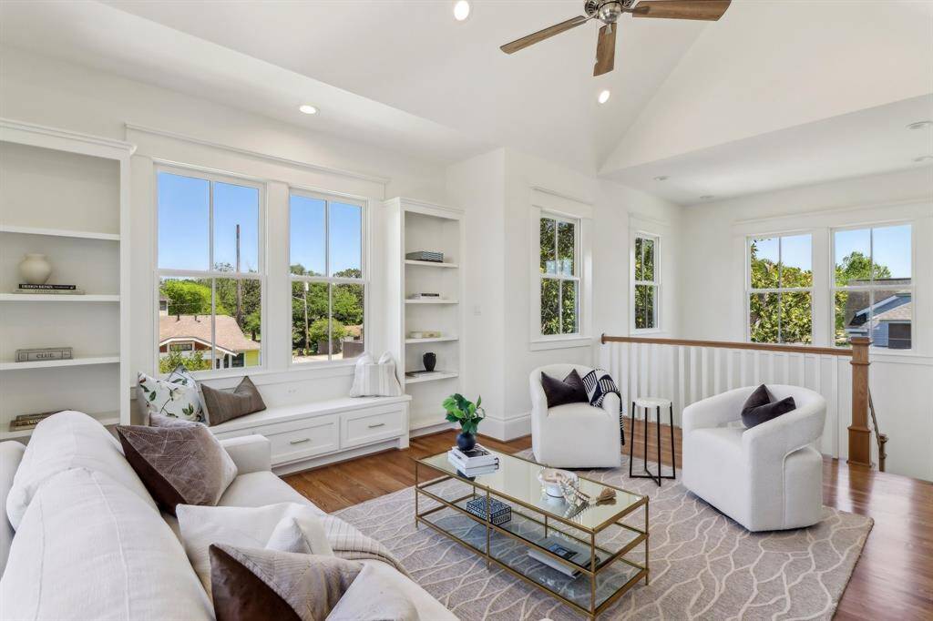 the second floor lands onto a flex space/game room/secondary living area.