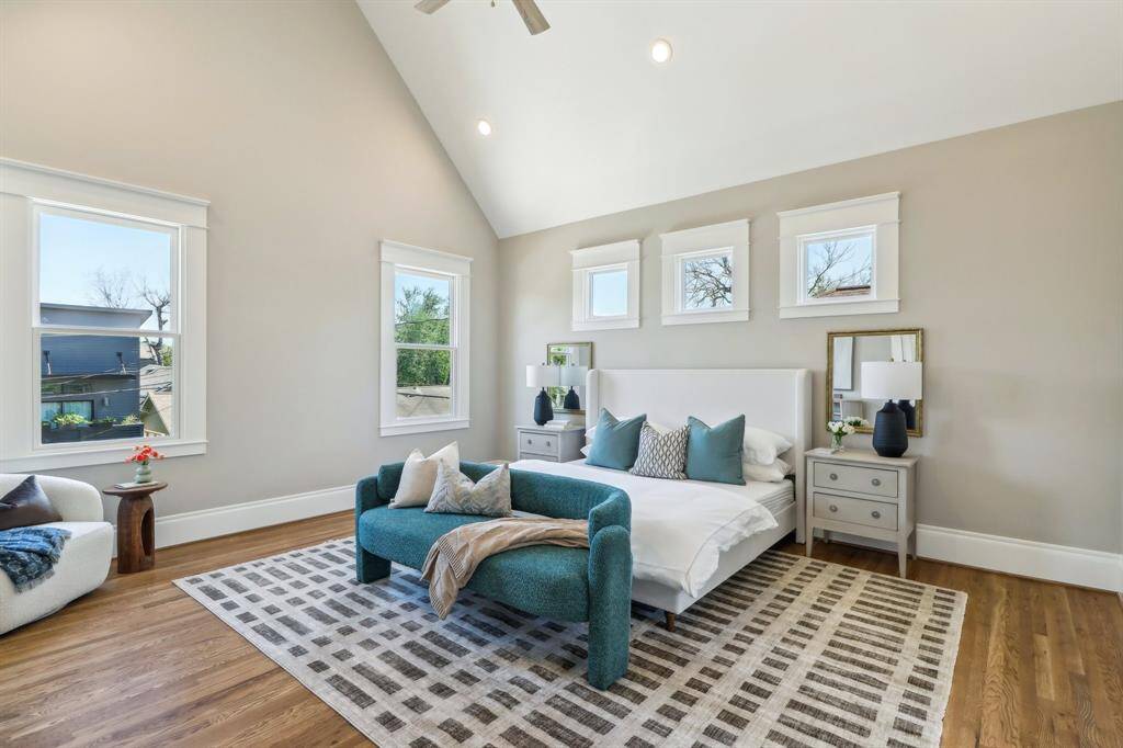 The primary bedroom features vaulted ceilings and two options for a bed wall. The room is spacious enough for a sitting space without being an oversized waste of space.