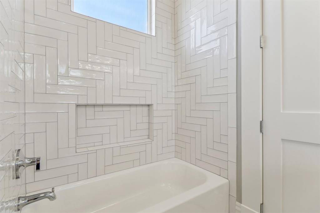 Secondary bathroom tub / shower combo.