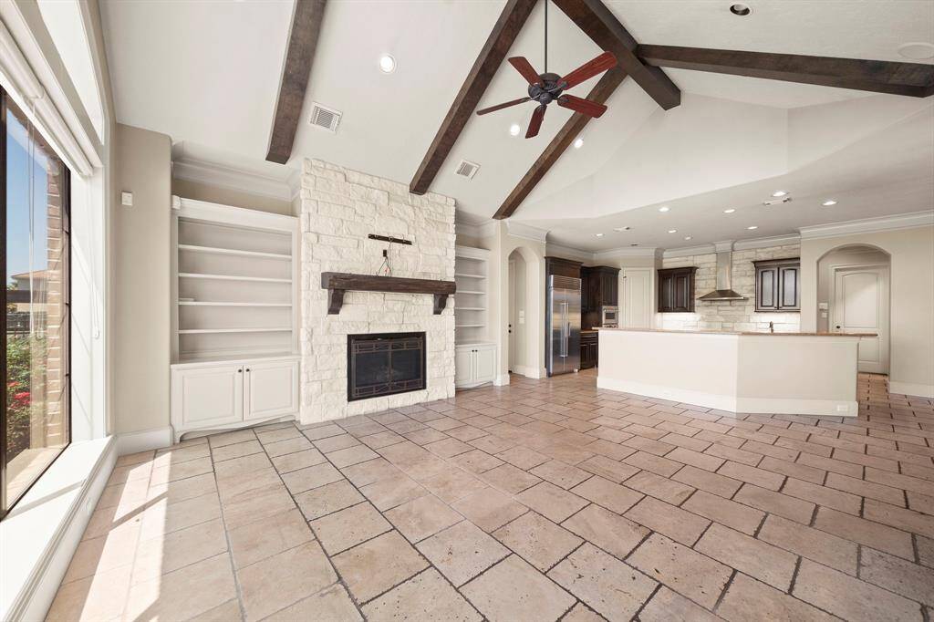 Large open family room to spacious kitchen. Lots of recess lighting and large windows