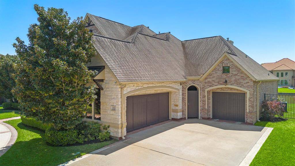3 car garage plus long driveway and circle driveway.