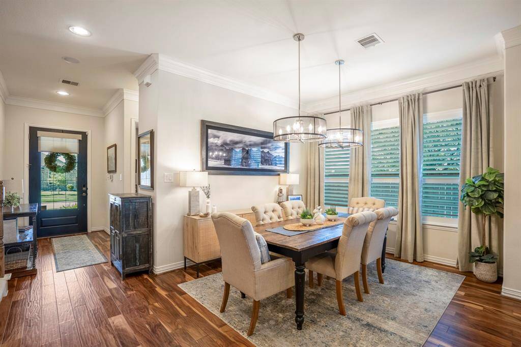 Three large windows afford tons of natural light and offer beautiful views of the landscaped backyard.