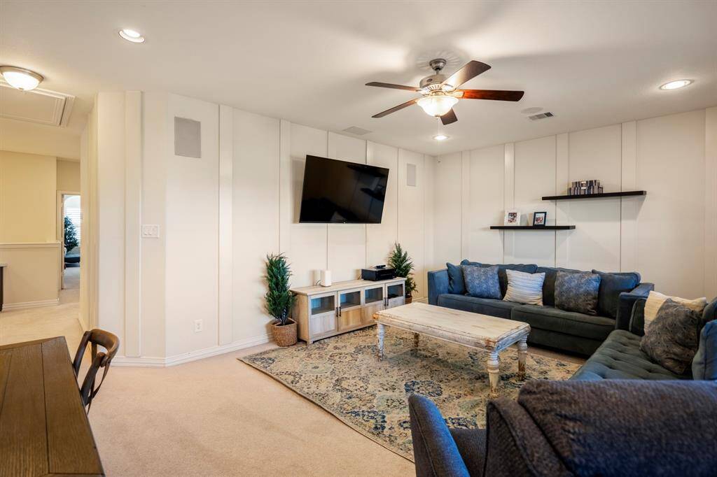 The second-floor sitting area, offers a quiet spot to read, enjoy a cup of coffee or watch TV without interrupting other family members or guests.