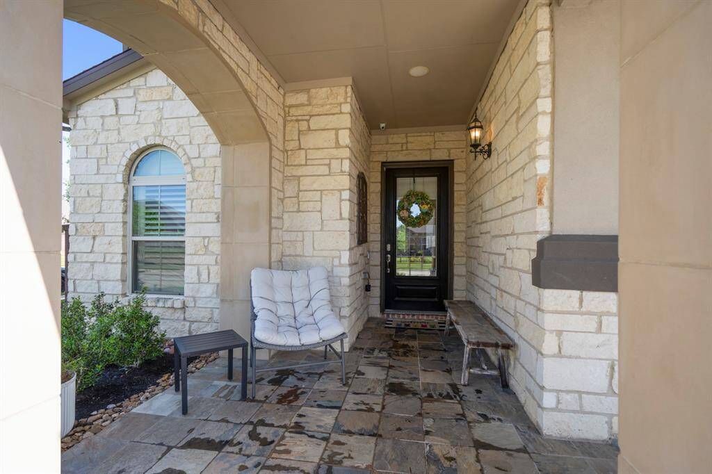 A large covered porch is the ideal place to sit and relax, while enjoying beautiful curb appeal from your corner lot.