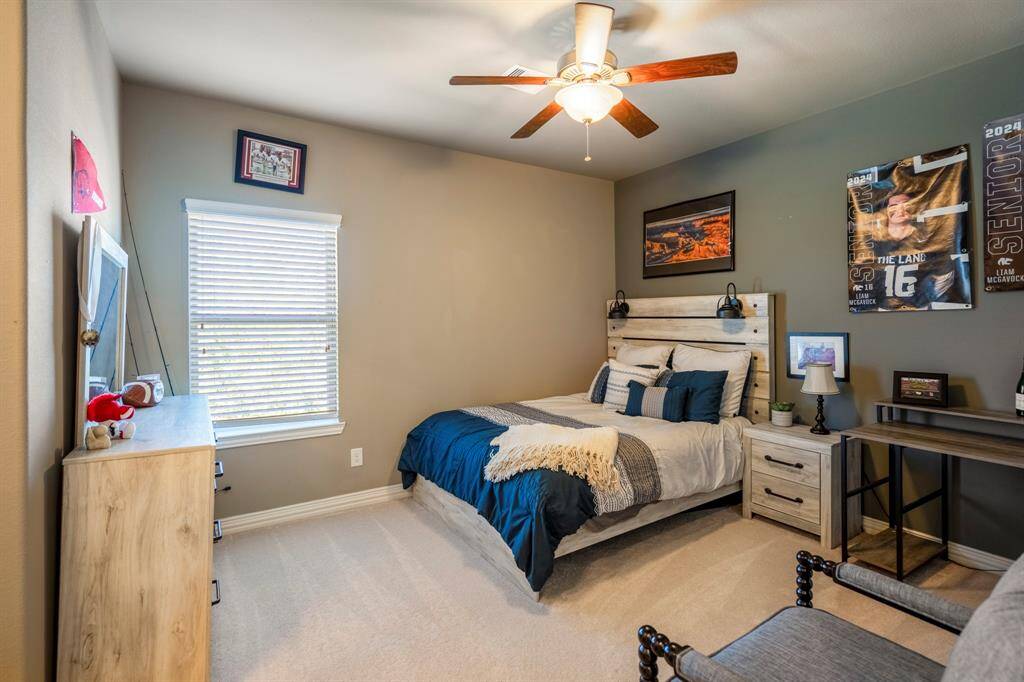 A huge third bedroom upstairs has neutral carpets, wall color and lighted ceiling fan and nice size closet.