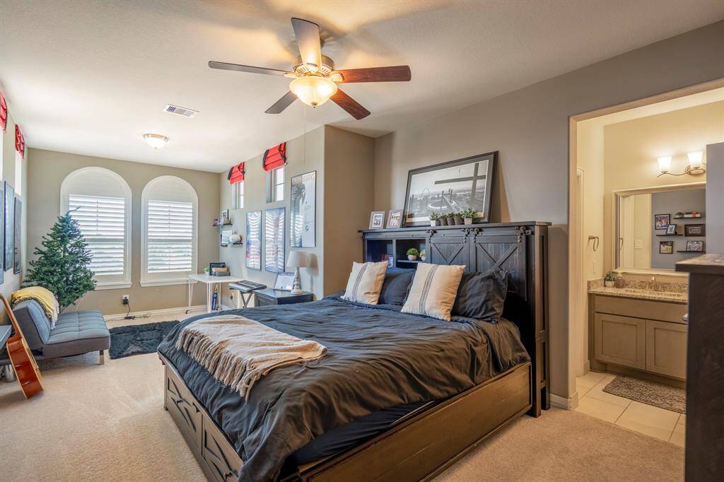 The fourth bedroom is large enough for a sitting area - would be an ideal guest suite, notice the dual arched windows.
