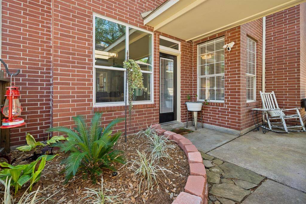 A view from the side entry to backyard and detached garage.
