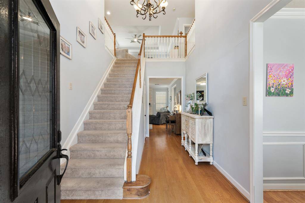 The Entry is very welcoming with a two-story ceiling and hardwood floors.