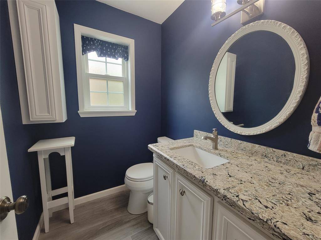 Downstairs powder room for guests.