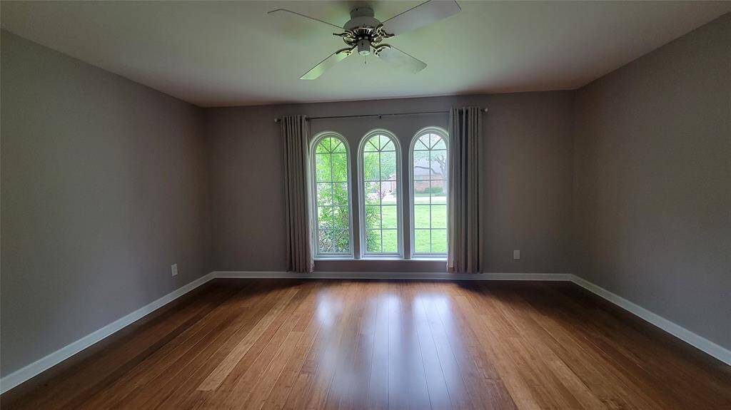 Primary bedroom on the first floor.  Beautiful windows!