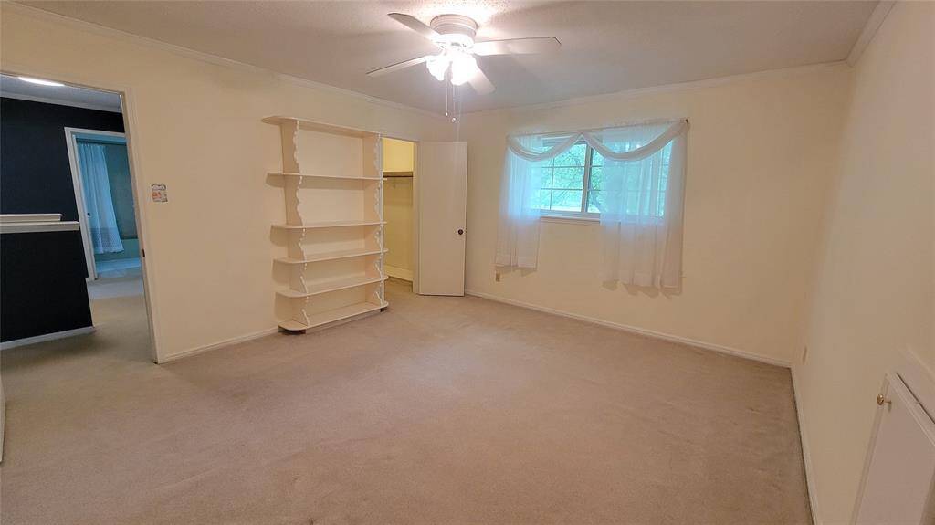 Bedroom 3 with built in bookcase.