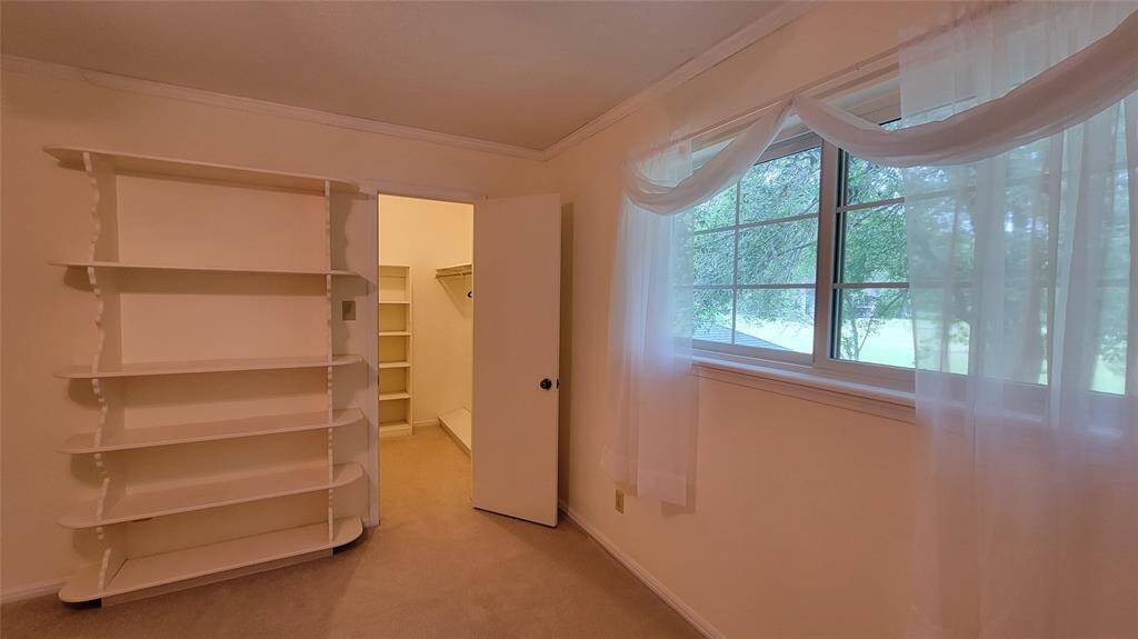 Bedroom 3 with walk-in closet and golf course view.