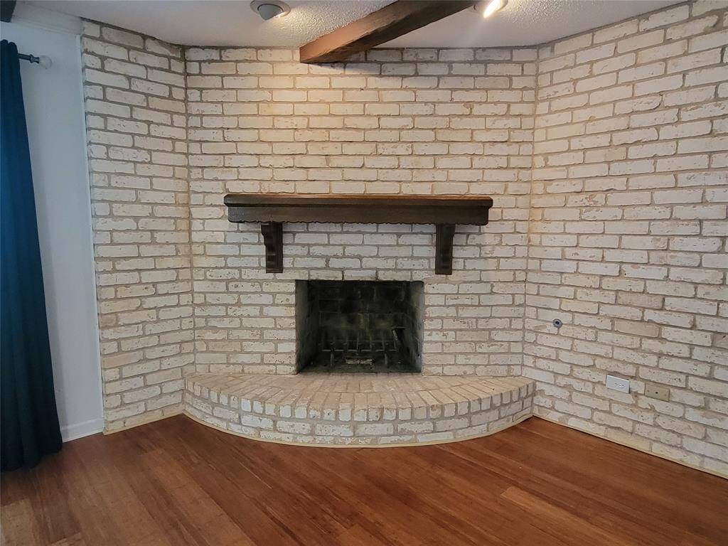 Wood burning fireplace with gas connections.