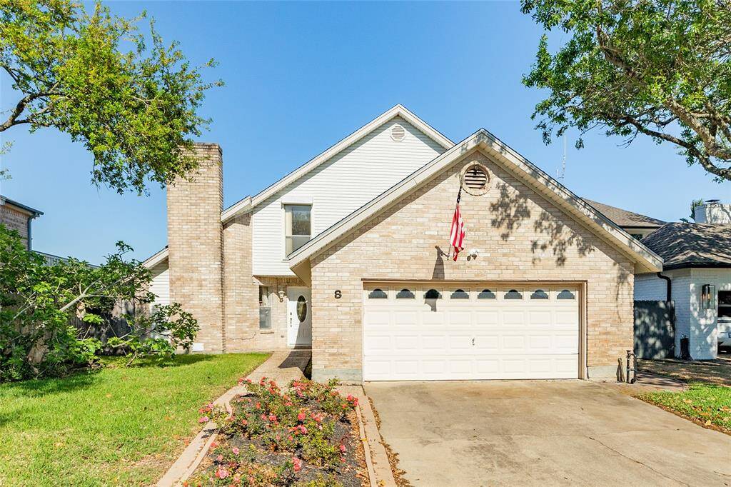 Front entrance to home with 2 car garage.