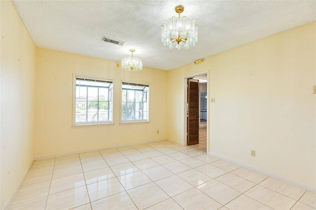 Dining space with waterfront views and entrance to kitchen.