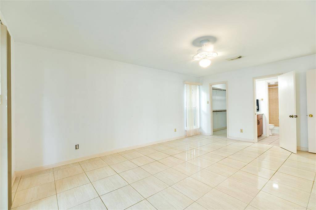First level bedroom suite with walk in closet and bathroom.