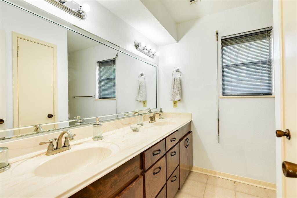 2nd floor bathroom with double sinks.