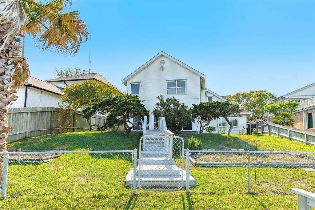 Back view of home and spacious yard.