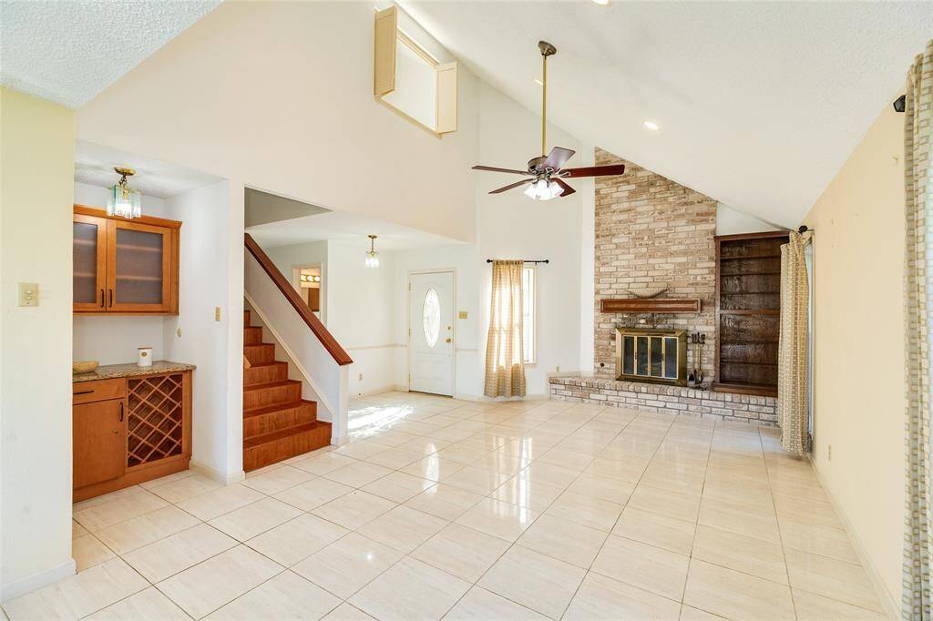 Nice entrance into the living space with fireplace, dry bar and  wine storage.