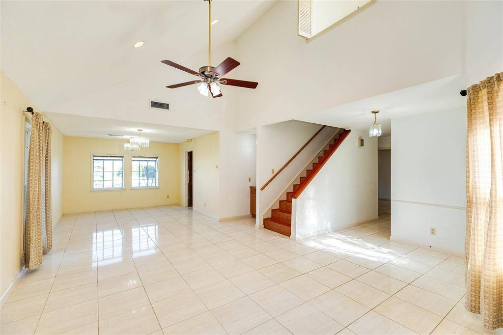 Very spacious living area and the dining space that is off the kitchen with waterfront views.