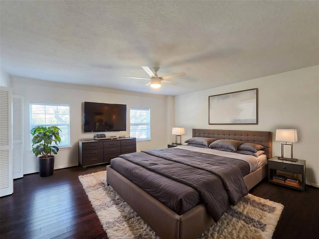 This sizable primary bedroom offers ample space and flexibility in furniture layout, allowing you to create the perfect retreat tailored to your style. [virtually staged]