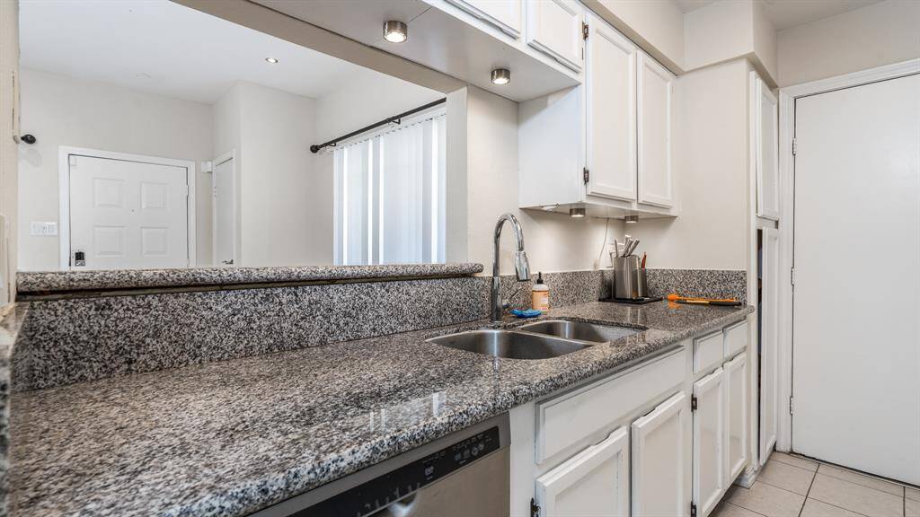 Dishwasher and pantry in kitchen.