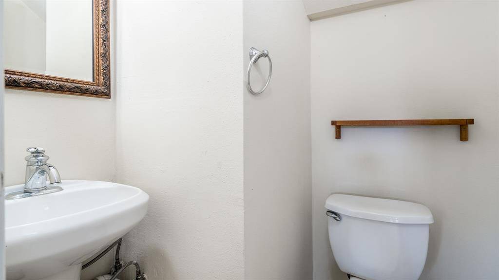 Downstairs half bath for your guest and convenience.