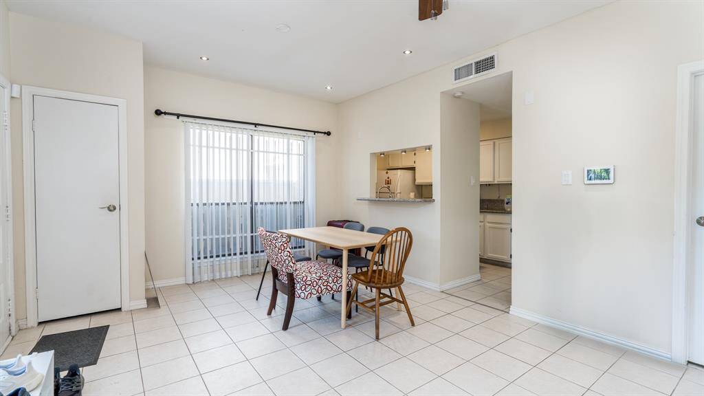 Dining area located right off of kitchen. Slider to private patio area.
