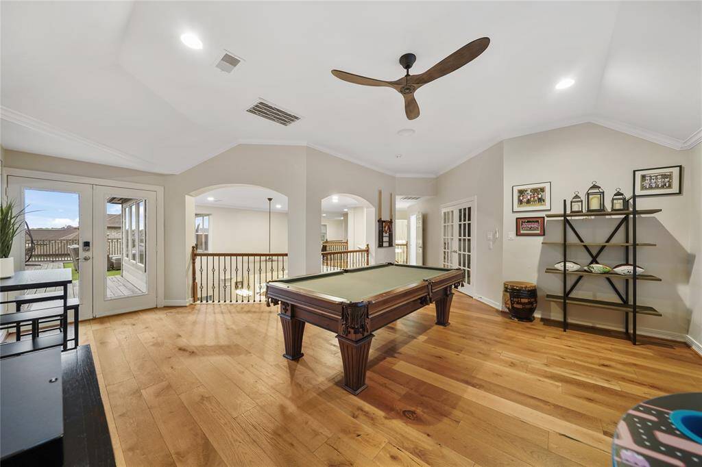 Game Room Space with French Doors that go out to the HUGE deck with an amazing view of the Backyard and Great Entertaining Space.