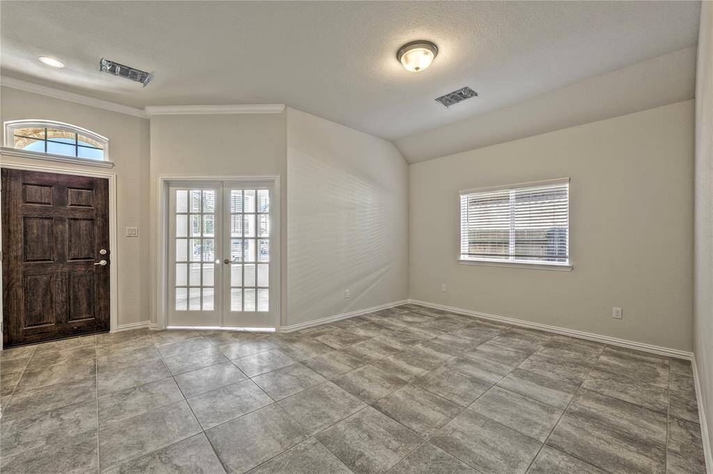 Formal dining area and French door study