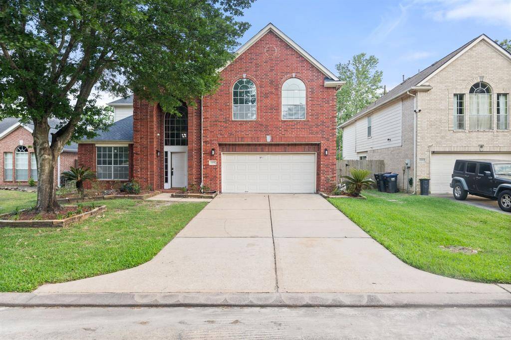 Welcome to 8506 Regalbrook Dr - a striking red-brick two-story with curb appeal, tall windows, and a double-door entry that makes a bold first impression.