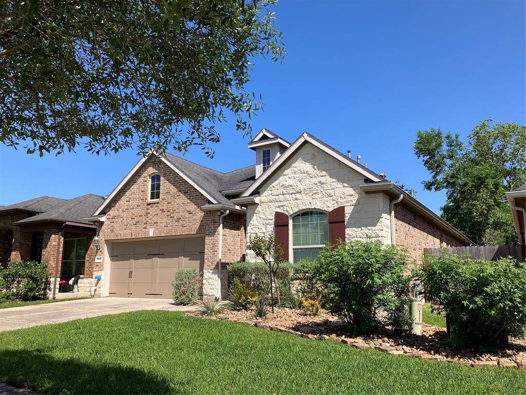 Charming stone home in small, friendly gated community on Lake Houston