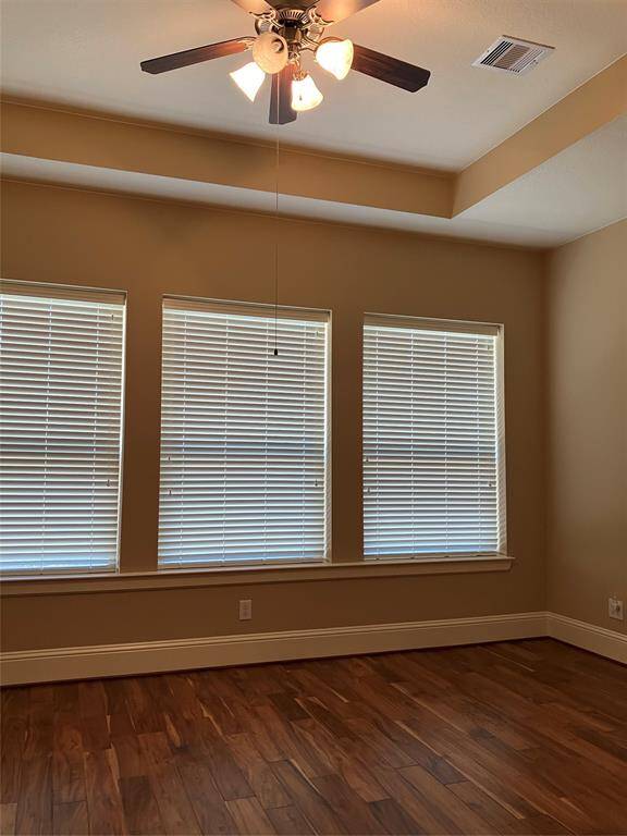 Primary bedroom is filled with ambient light