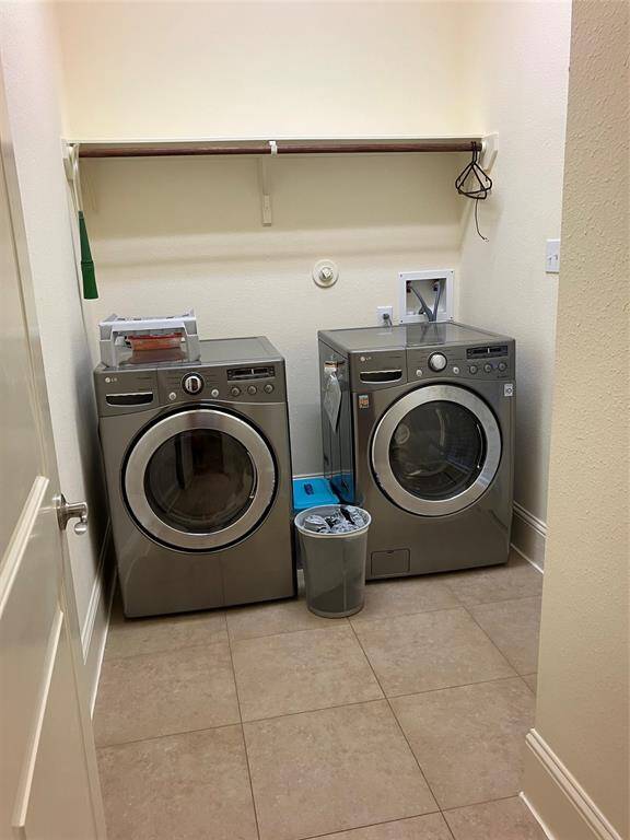Utility room with matched washer and dryer