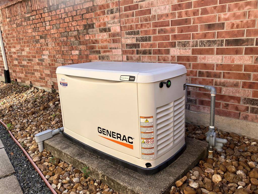 Generac whole-house generator is a Godsend if there is ever a power outage. Out of sight at the side of the home.