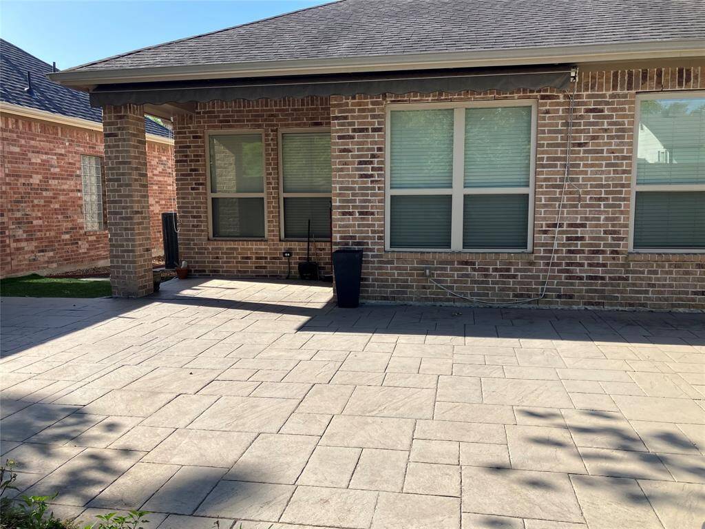 Covered porch has sunshade and awning; imagine relaxing in the breeze with morning coffee or a glass of wine at sunset.