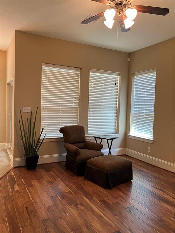 Spacious family room with high ceiling and those stunning scraped hickory floors