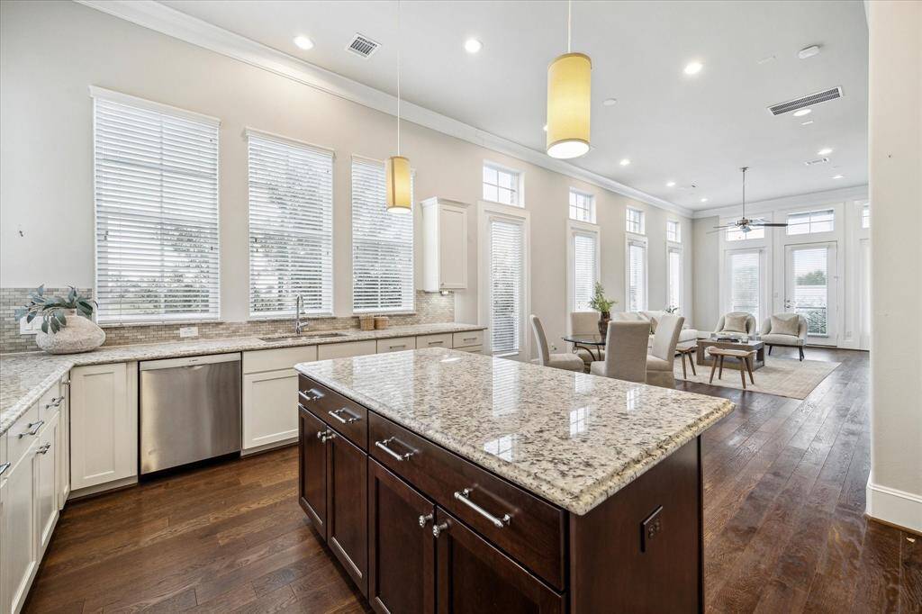 Gas cooktop, stainless steel appliances, and under cabinet lighting
