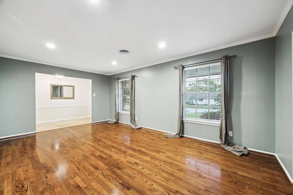 Formal den with beautiful hardwood floors. Enty mirror is included!