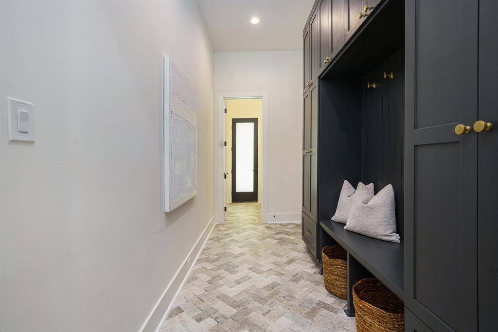 Mudroom leading to the garage and powder room, great flow
