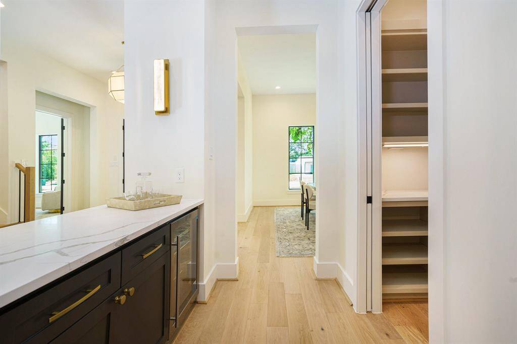 Pass through bar and custom pantry will make hosting a touch easier.