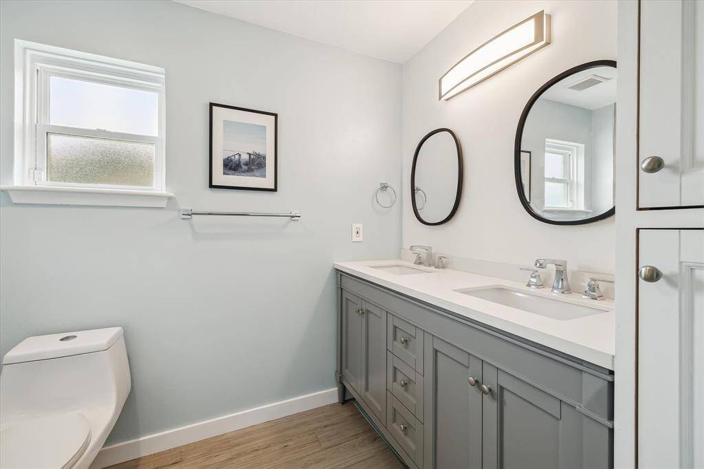 Another view of the spa-inspired primary bath highlights the abundant counter space and built-in storage.