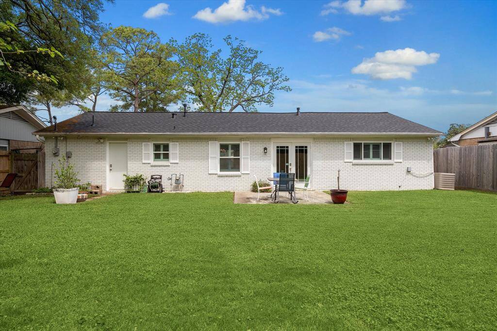 The fully fenced backyard offers plenty of room for pets, gardening, or outdoor playtime activities.